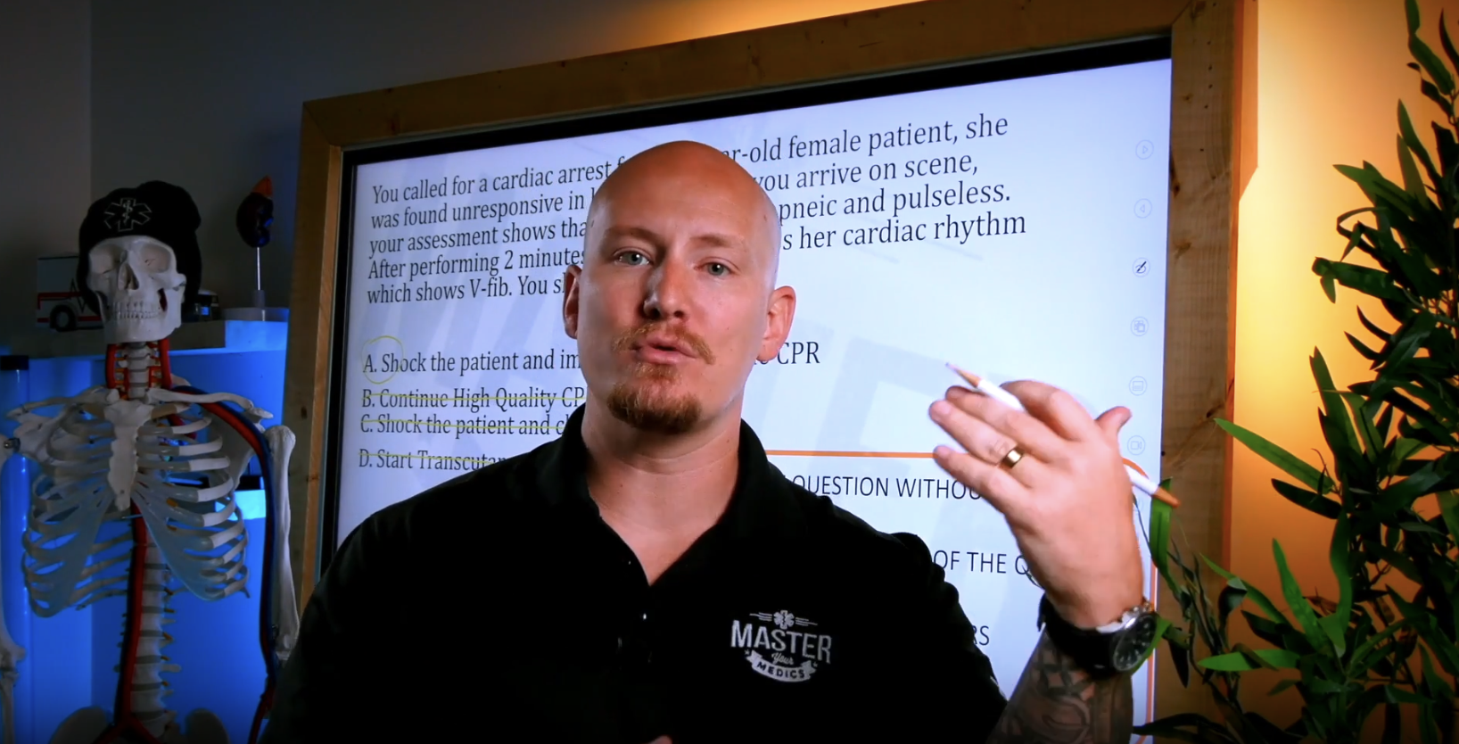 Master Your Medics lead instructor teaching a live COPR-style paramedic scenario on a lightboard